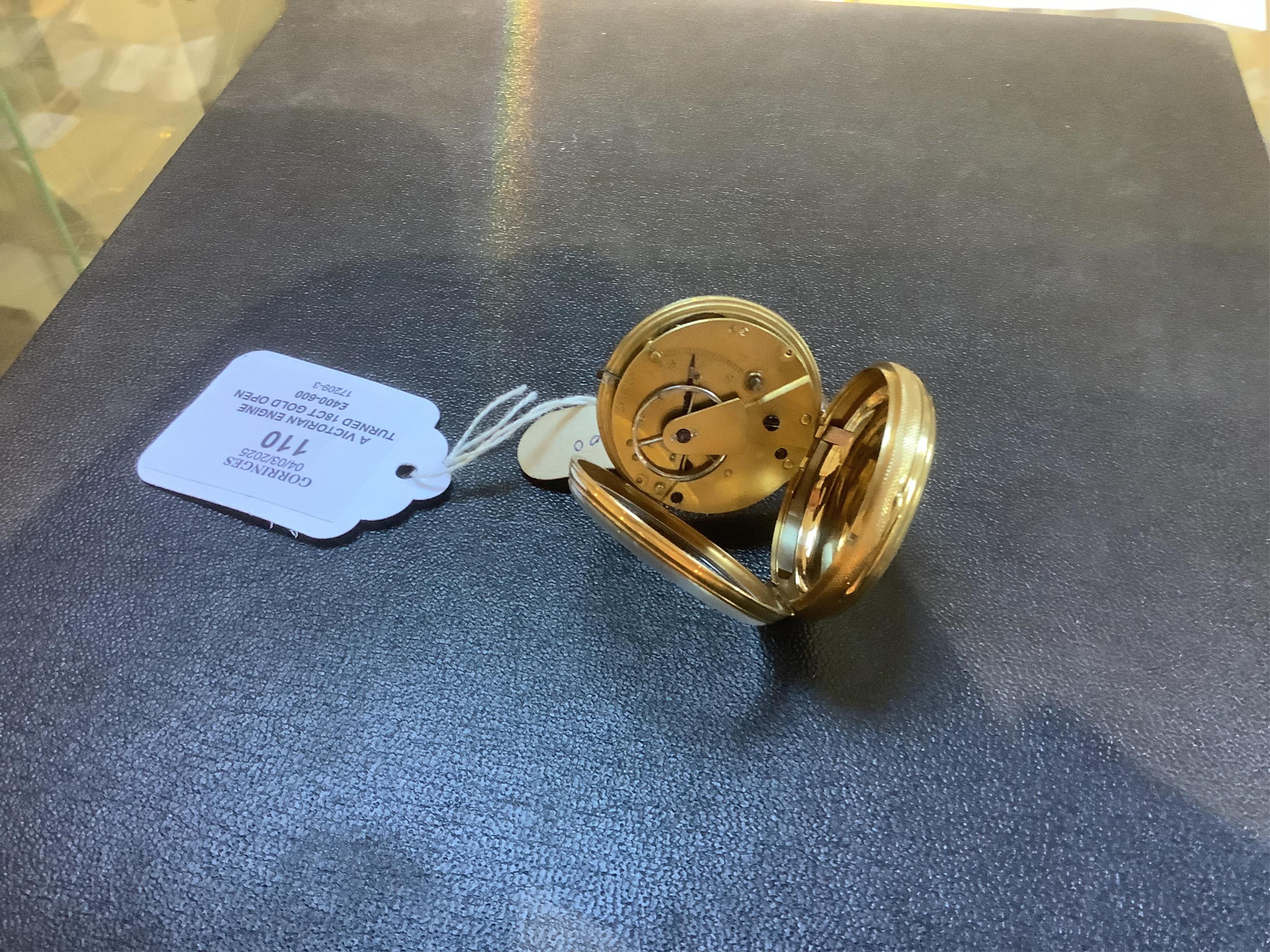 A Victorian engine turned 18ct gold open faced key wind fob watch